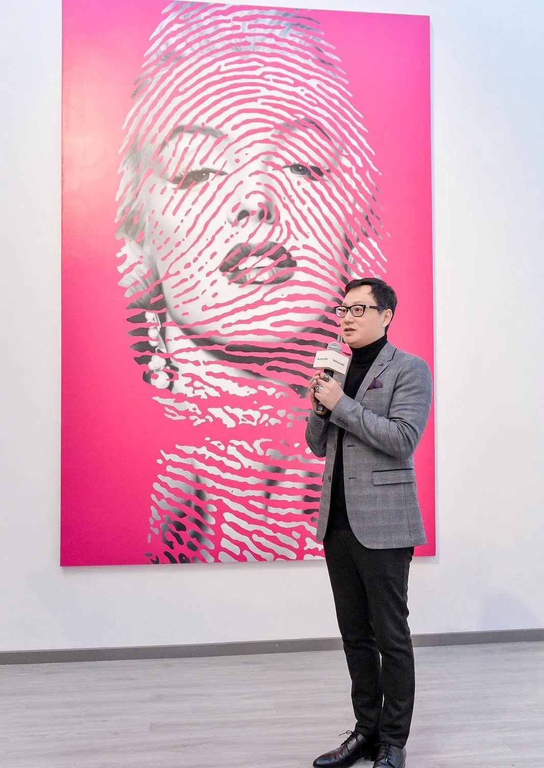 Zou Cao talking in an Exhibition
